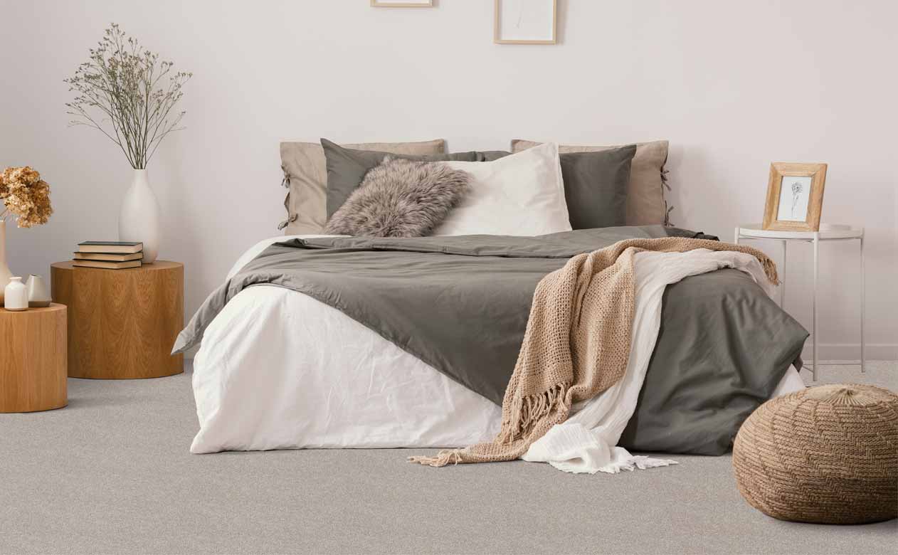 Bedroom with bed and gray carpet